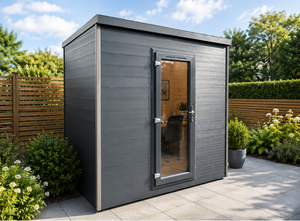 Composite garden room with full-height glazed door, set in a landscaped garden