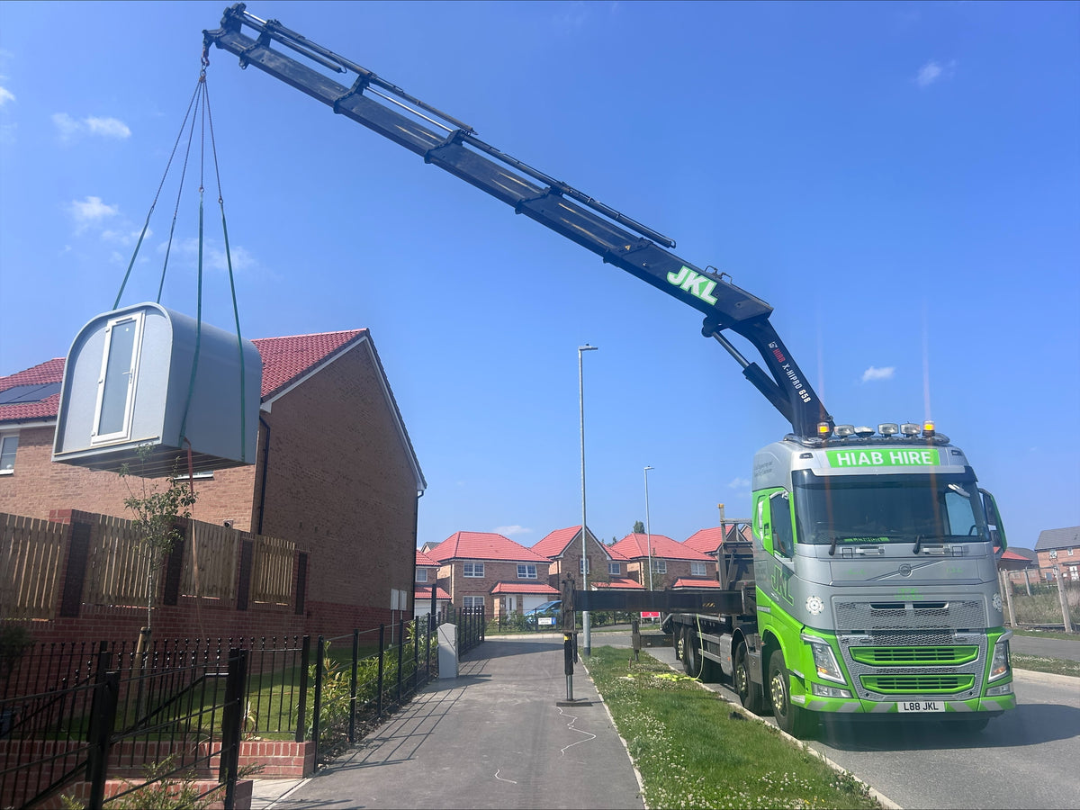 Pod being delivered by crane